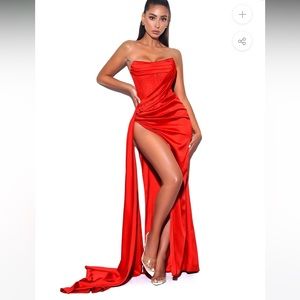 Red gown in size Large (10-12) with high split.